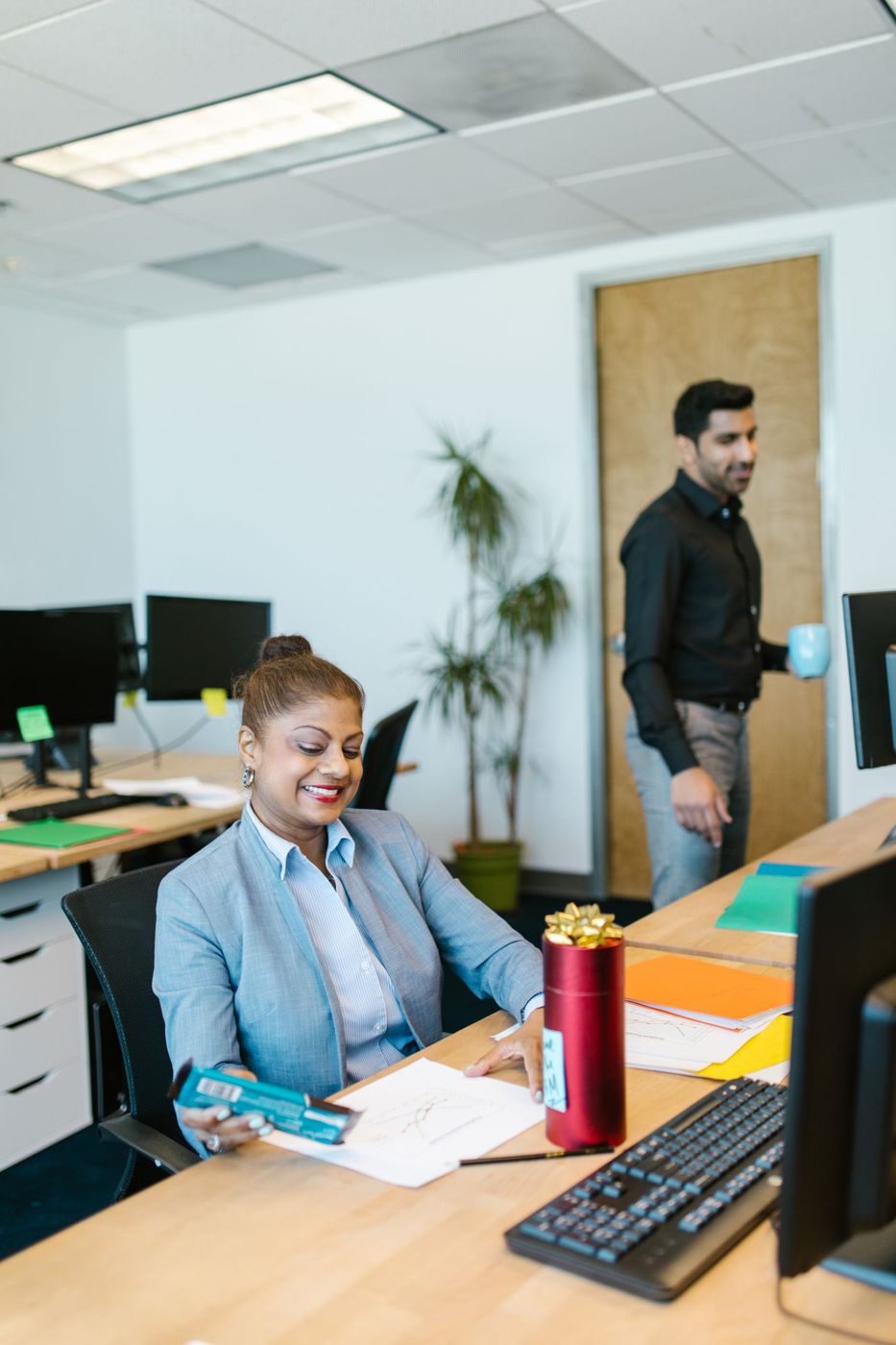 Colleagues working together at an office desk
